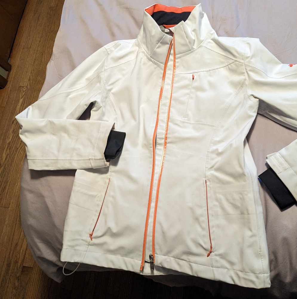 Womens Descente Lotus shell jacket, size 8, white with orange and black trim.